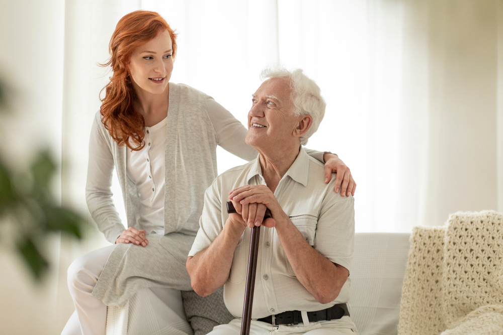 Smiling,Senior,Man,With,Walking,Stick,And,His,Happy,Granddaughter